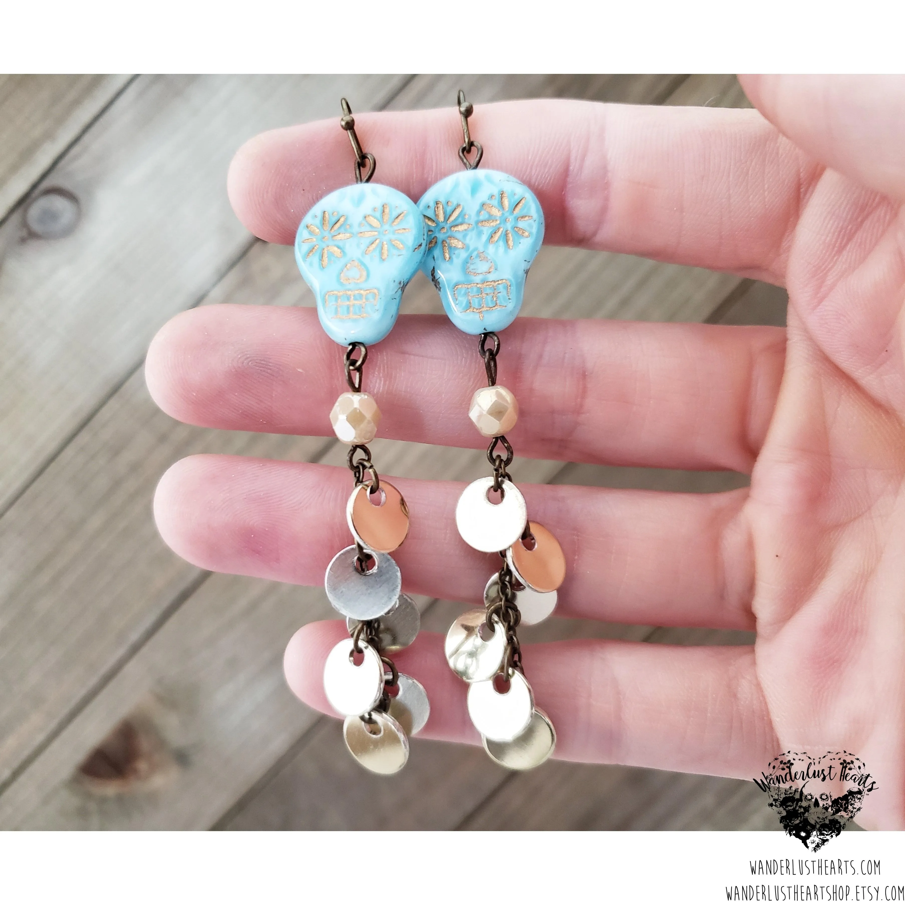 Skull coin duster earrings