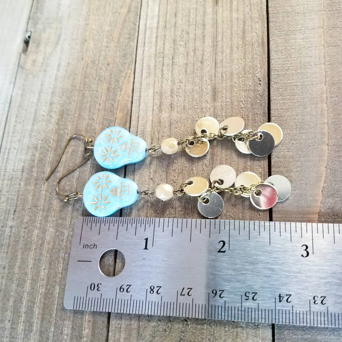 Skull coin duster earrings